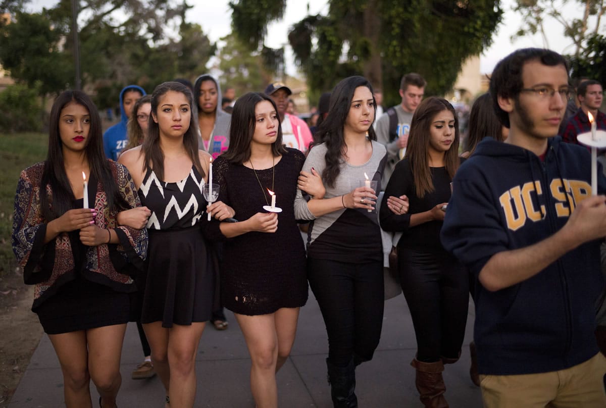 Students march May 24 on the campus of the University of California, Santa Barbara during a candlelight vigil held to honor the six victims of a mass killing in Isla Vista, Calif. Sheriff's officials said Elliot Rodger, 22, went on the rampage near UC Santa Barbara.
