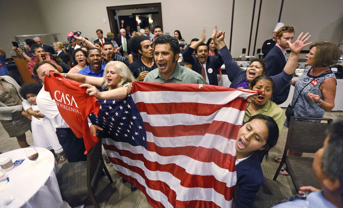 Immigration reform supporters crash the primary-night party of House Majority Leader Eric Cantor, R-Va., after he delivered a concession speech in Richmond, Va., Tuesday, June 10, 2014. Cantor lost in the GOP primary to tea party candidate Dave Brat.