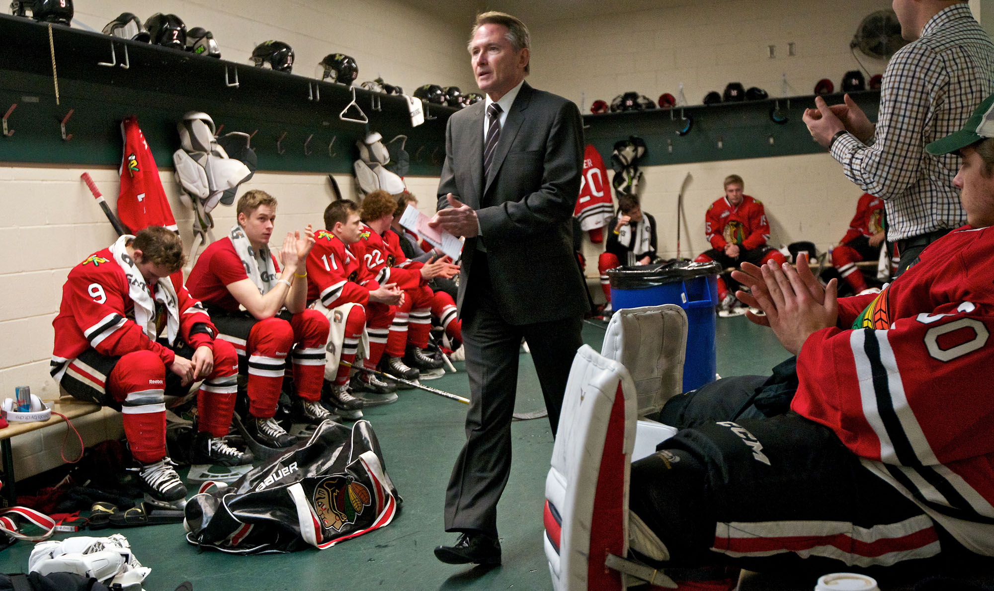 Head Coach Mike Johnston finishes a pre-game talk before his team takes the ice against Everett on Sunday January 26, 2014.