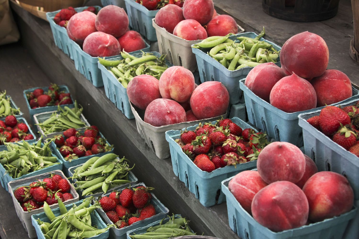 Peaches, strawberries, and snap peas are for sale at a roadside market outside Gettysburg, Pa., in June 2013. Pregnant women, mothers and children who get federal assistance with their grocery bills will now be able to buy more whole-grain foods, yogurt, fish, fruits and vegetables.