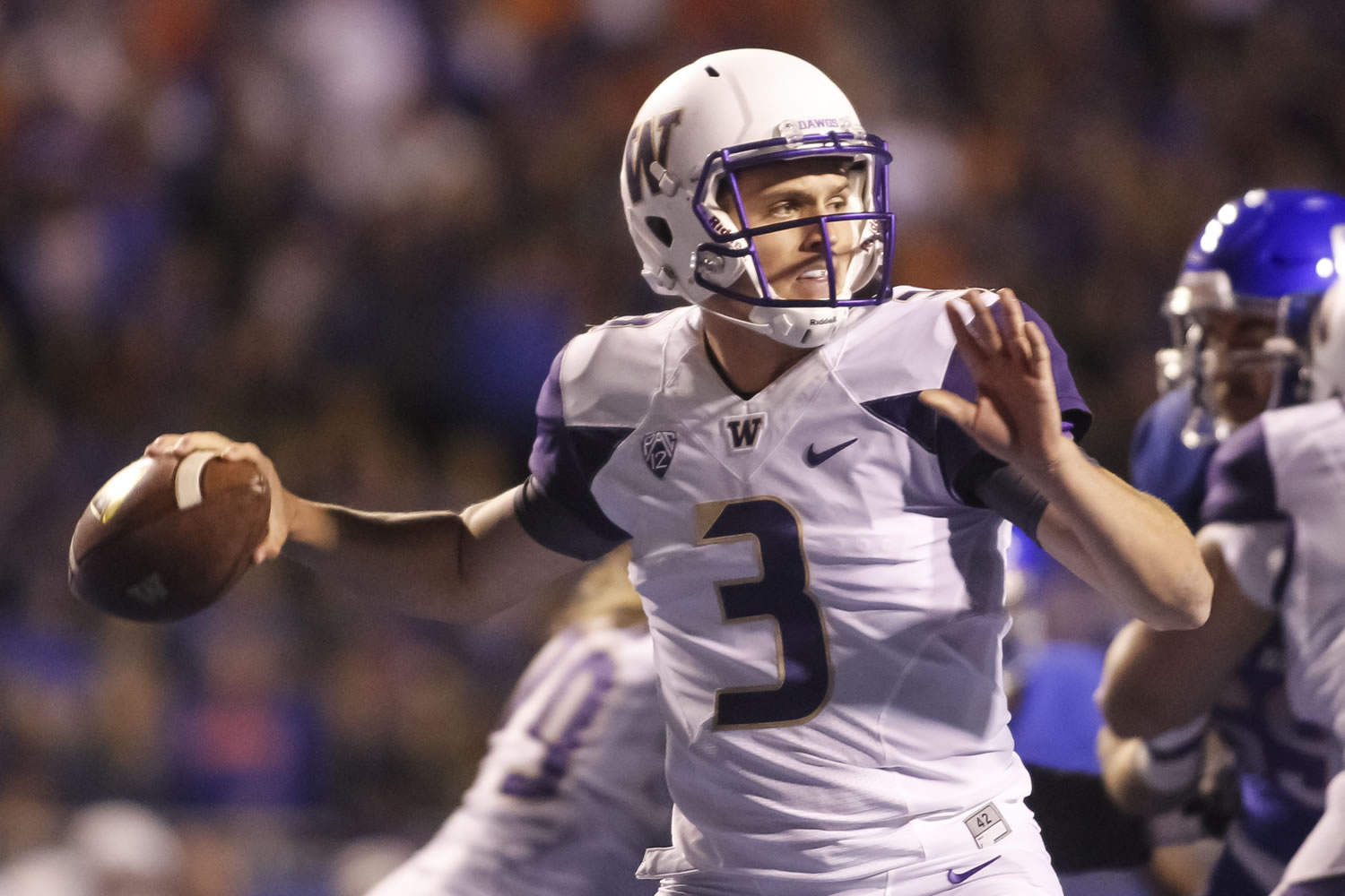 Washington quarterback Jake Browning looks for a receiver during the first half of an NCAA college football game against Boise State in Boise, Idaho, on Friday, Sept. 4, 2015.