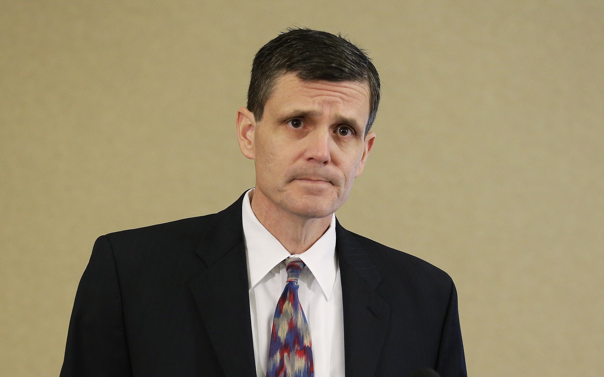 Washington state Auditor Troy Kelley listens to a question from a reporter Thursday in Tacoma. Earlier in the day, Kelley entered a not guilty plea to a federal grand jury indictment on charges of filing false tax returns, attempted obstruction of a civil lawsuit and possession of stolen property. Gov. Jay Inslee has called for Kelley to resign. (AP Photo/Ted S.