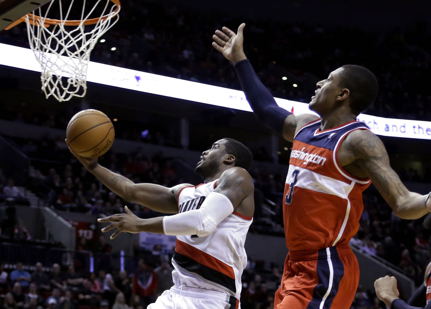 Portland Trail Blazers guard Wesley Matthews, left, drives to the basket past Washington Wizards guard Bradley Beal during the second half Thursday. Matthews led the Trail Blazers with 28 points as they won 116-103.