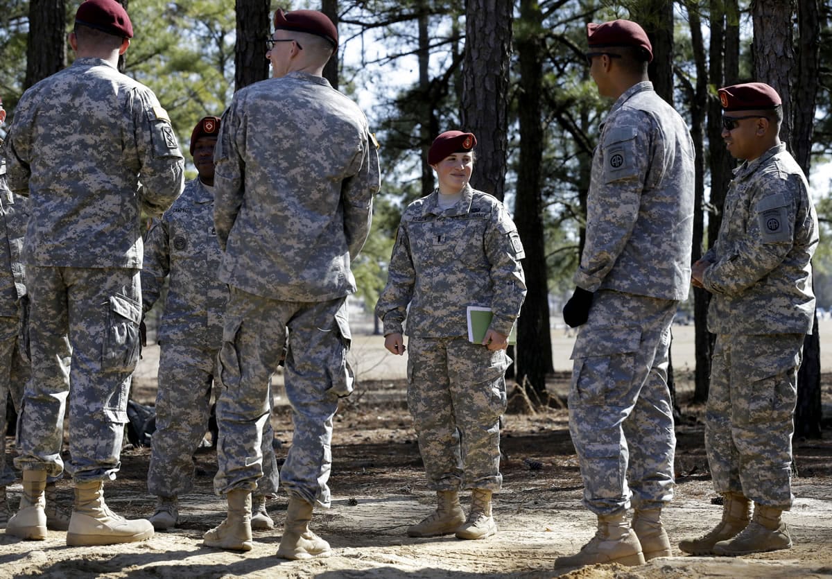 1st Lt. Kelly Requa, third from right, speaks Feb. 18 with troops during certification at a fires direction center at Ft.