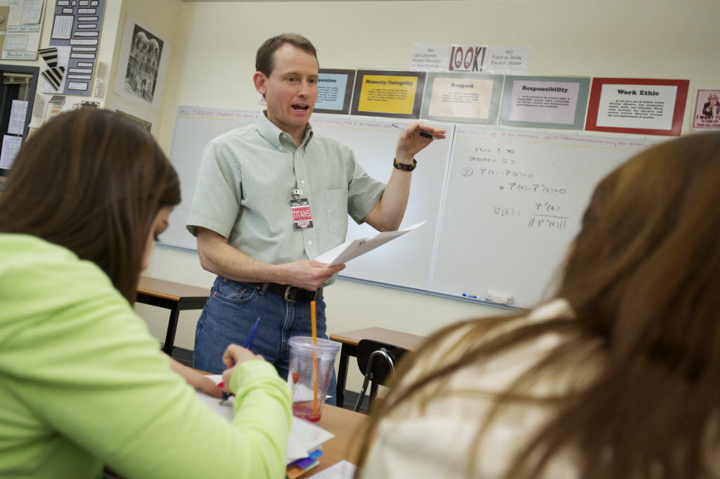 Hewlett-Packard employee and STEM volunteer John Sturman helps students with AP calculus at Union High School in November.