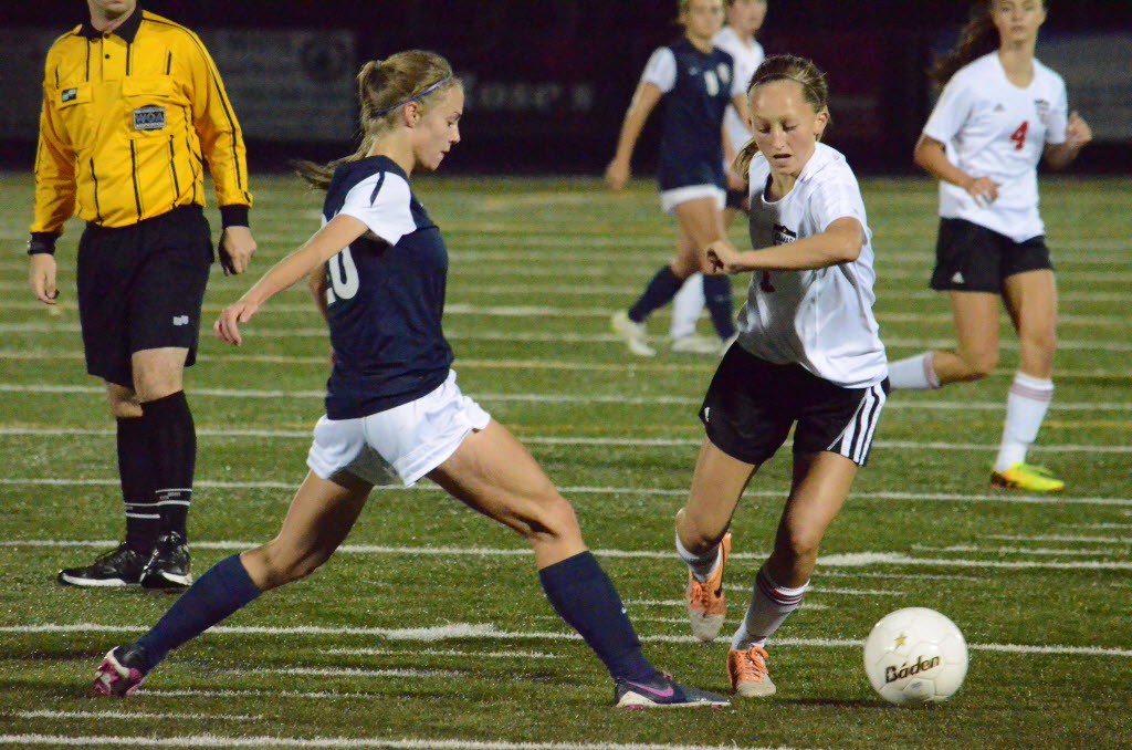 Camas midfielder Sabine Postma is challenged by Skyview defender Becca Harris during a 4A Greater St. Helens League soccer match Tuesday in Camas.