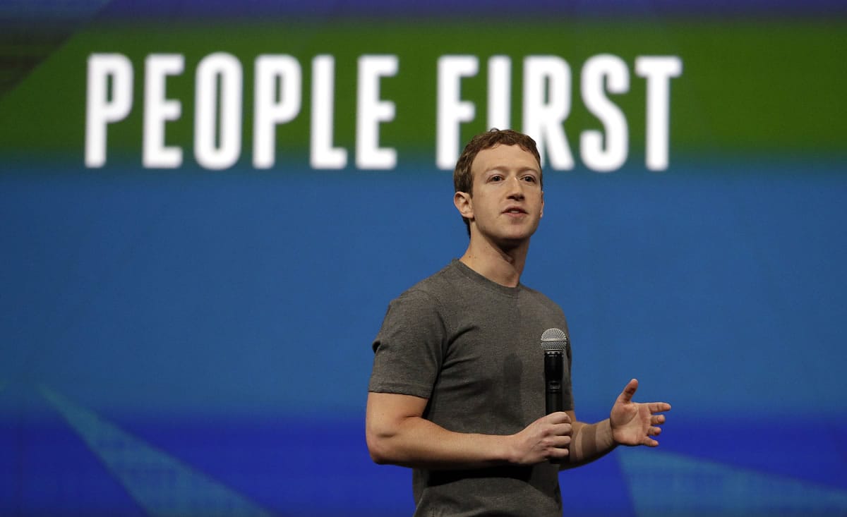 Facebook CEO Mark Zuckerberg gestures while delivering the keynote address  April 30 at the f8 Facebook Developer Conference in San Francisco. Zuckerberg and his wife, Priscilla Chan, are donating $120 million over the next five years to the San Francisco Bay Areais public school system.