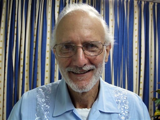 In this Nov. 27, 2012 file photo provided by James L. Berenthal, jailed American Alan Gross poses for a photo during a visit by Rabbi Elie Abadie and U.S. lawyer James L. Berenthal at Finlay military hospital as he serves a prison sentence in Havana, Cuba. AP sources: American Alan Gross released from Cuba after 5 years in prison. (AP Photo/James L.