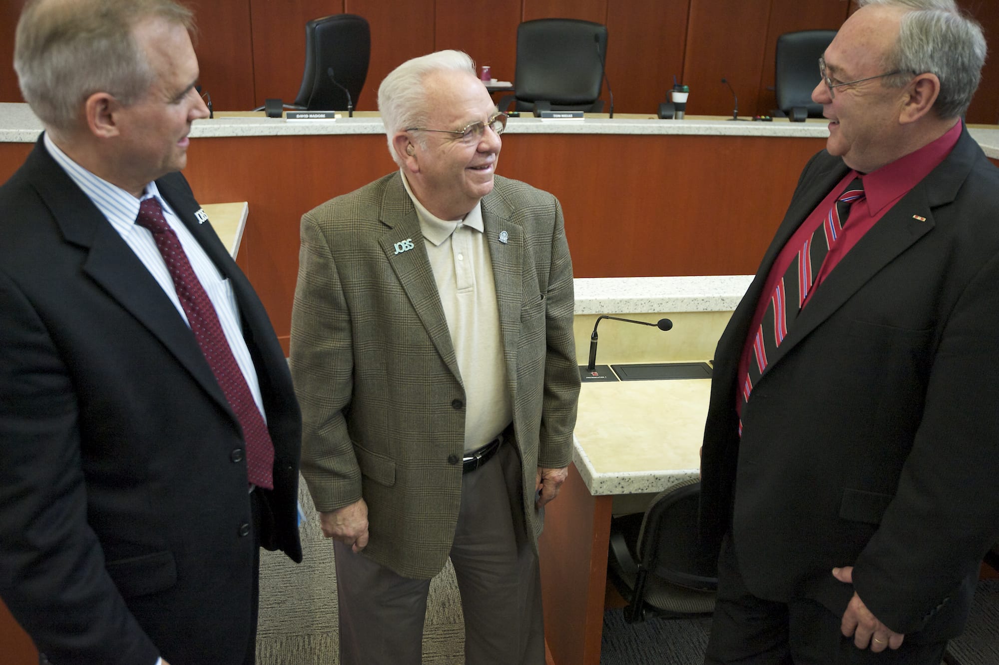 Clark County Commissioners  David Madore, left, and Tom Mielke, right, talk to Ed Barnes, on Tuesday June 3, 2014, after appointing him to fill the seat on the board that was vacated by Steve Stuart earlier this year.