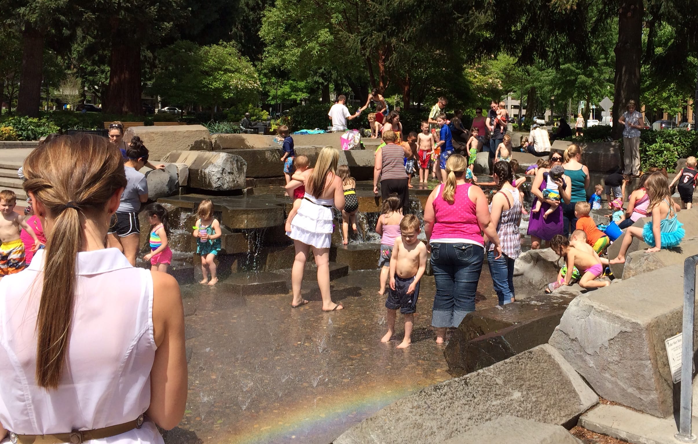 Scenes like this one from May 1, with area children and some adults cooling off in the water at Esther Short Park in downtown Vancouver, may be repeated over the next week as an extended heat wave blankets the region.