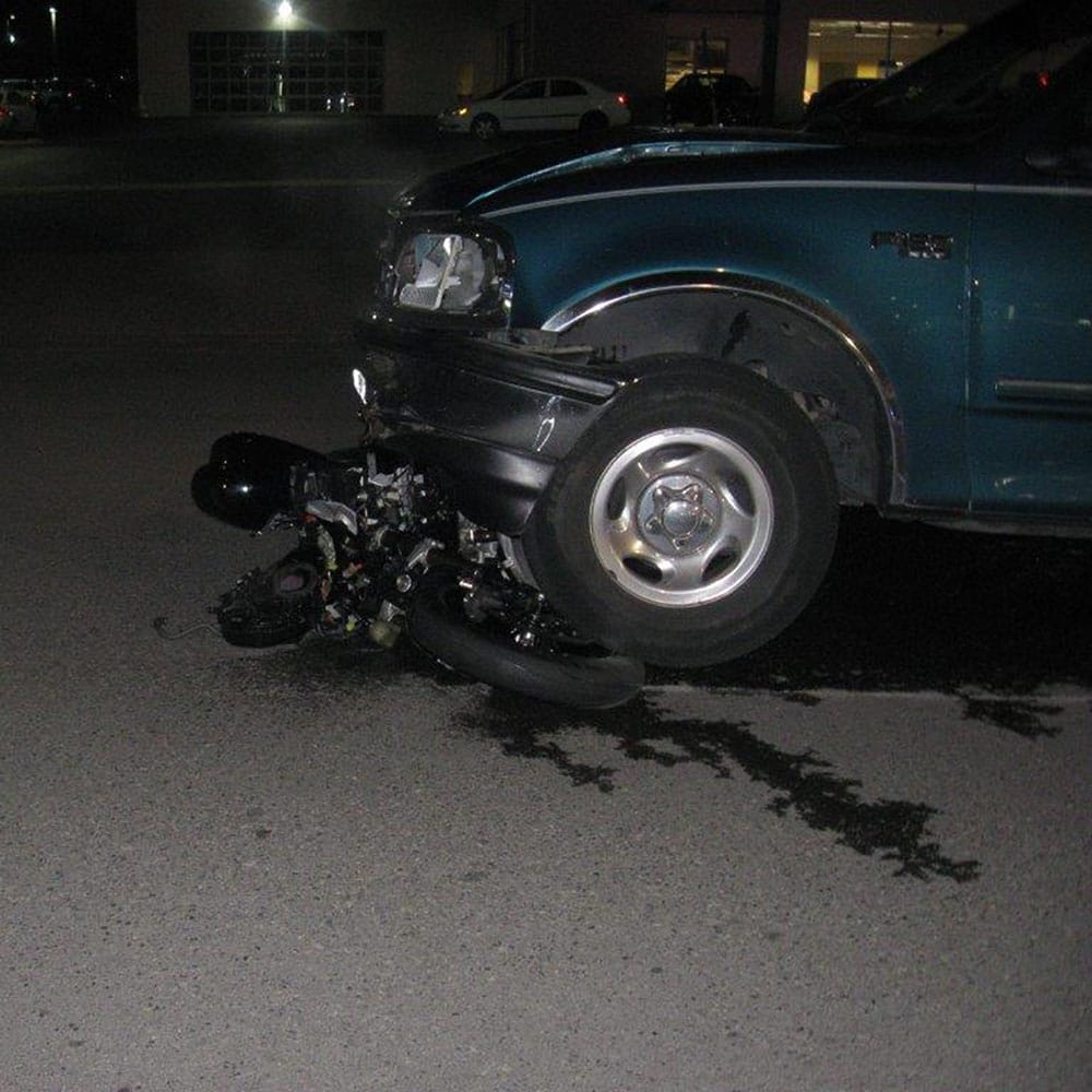 Police say an off-duty Clark County firefighter assisted at the scene early Sunday of a hit-and-run collision between a motorcycle and a truck. The motorcycle's driver was seriously injured.