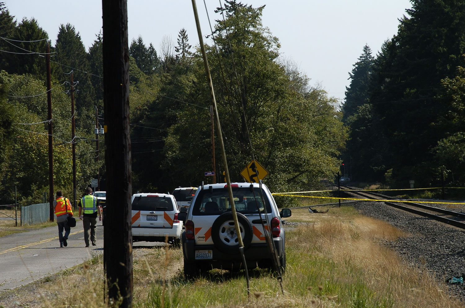 Emergency officials respond to the scene where an Amtrak train collided with an SUV Sunday morning in Vancouver, killing the man who was driving the SUV.