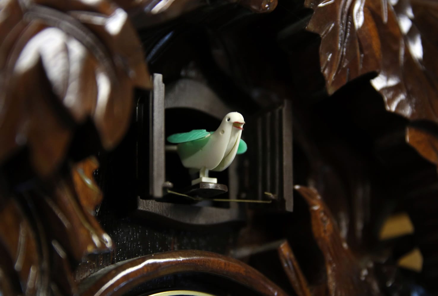 Mike De Sisti/Milwaukee Journal Sentinel
A traditional cuckoo bird pops out of a quartz battery-operated cuckoo clock at Bill Galinsky's workshop in Waukesha, Wis.