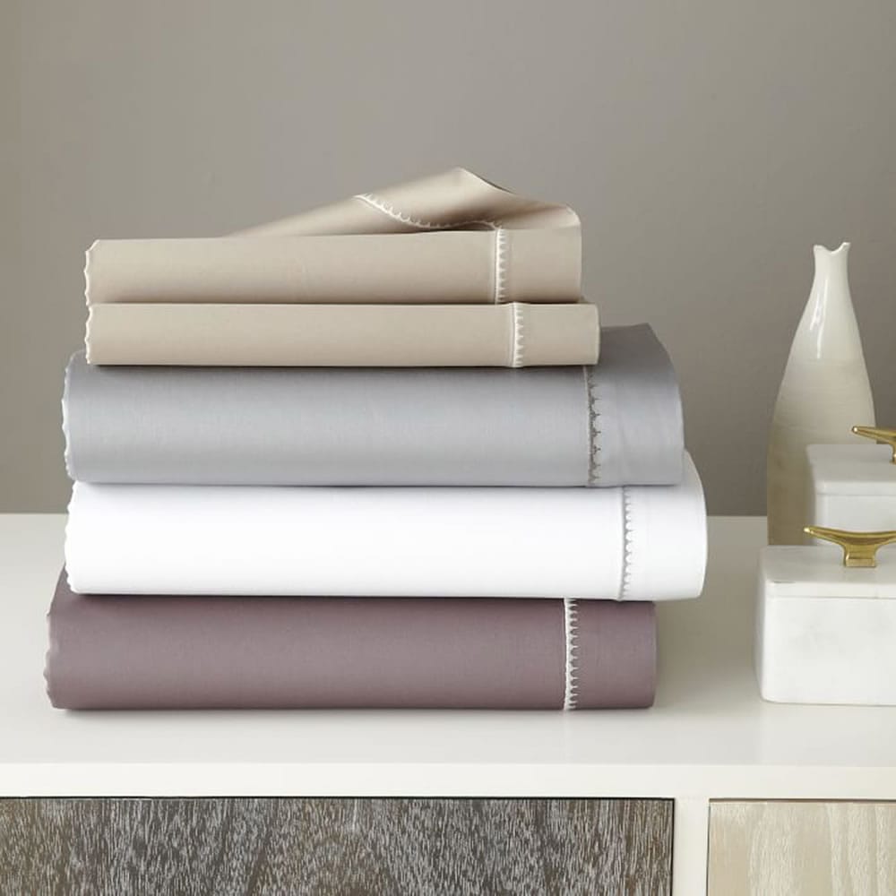 West Elm
These 350-thread-count sateen sheets from West Elm are made of 100 percent organic cotton and feature an embroidered scalloped edge.