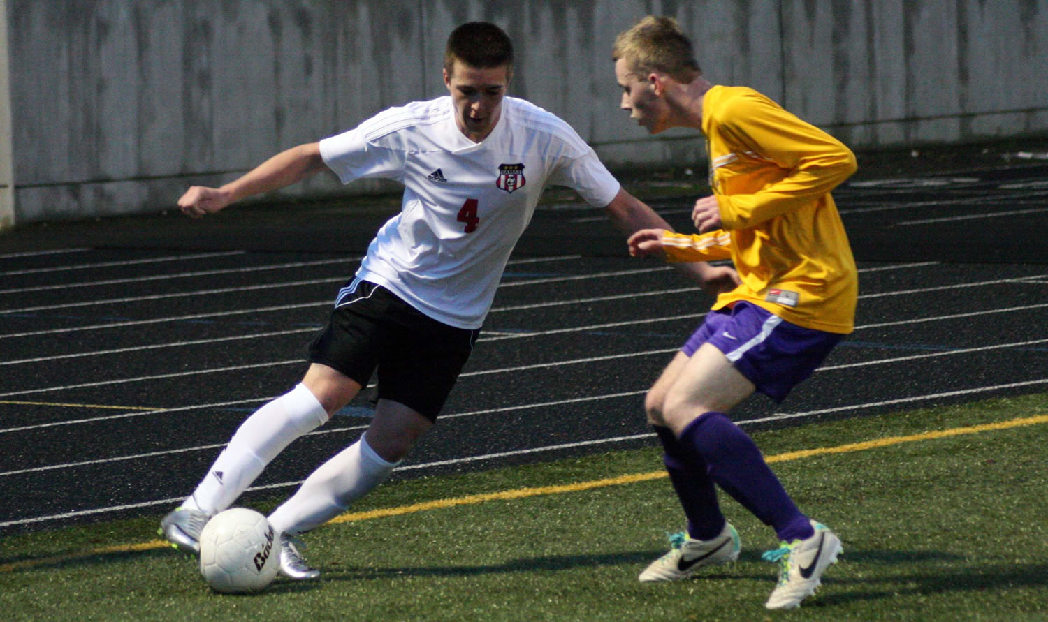 Camas forward Cayne Cardwell keeps the soccer ball alive for the Papermakers in the far right corner at Doc Harris Stadium.