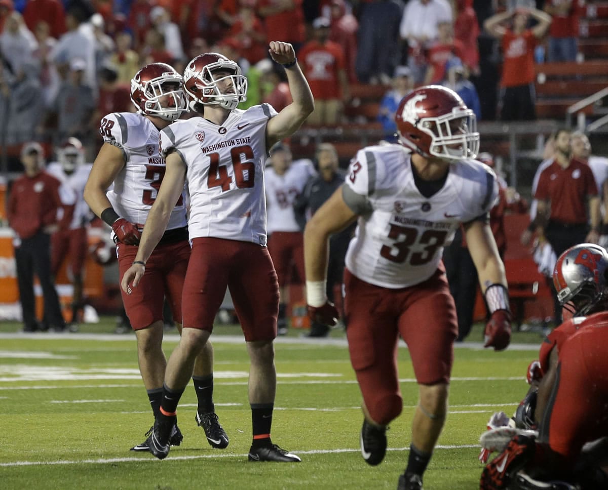 Washington kicker State Erik Powell (46) celebrates his point after kick during an NCAA college football game against Rutgers Saturday, Sept. 12, 2015, in Piscataway, N.J.