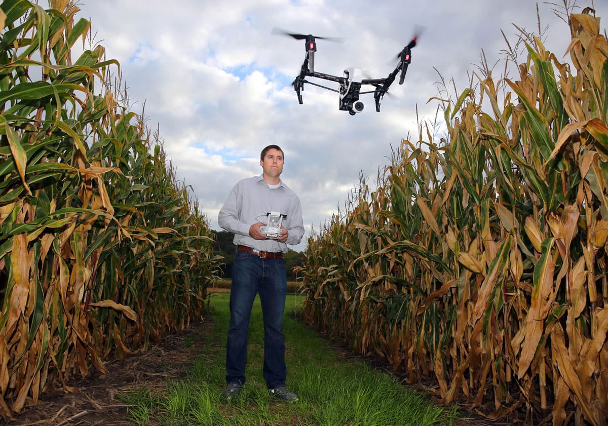 Zach Fiene, co-founder of aerial drone company DMZ Aerial, flies a drone at a test plot in Mazomanie, Wis., on Sept. 22. The company&#039;s drone technology gives farmers an overview of crops to more easily determine problem areas.