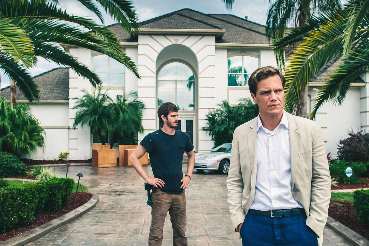 Andrew Garfield, left, stars as Dennis Nash with Michael Shannon as Rick Carver in &quot;99 Homes.&quot; (Hooman Bahrani/Broad Green Pictures)