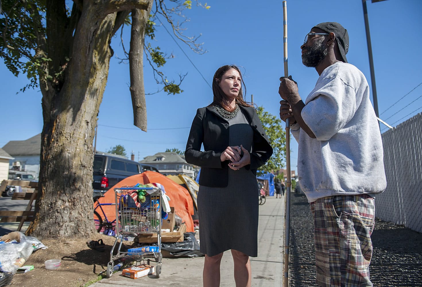 Vancouver City Councilor Alishia Topper talks recently with Calvin Chastang, who camps in downtown Vancouver. The community rallied early this year to rescue families at Courtyard Village Apartments from homelessness; now, more homeless people have been appearing on the streets of West Vancouver.
