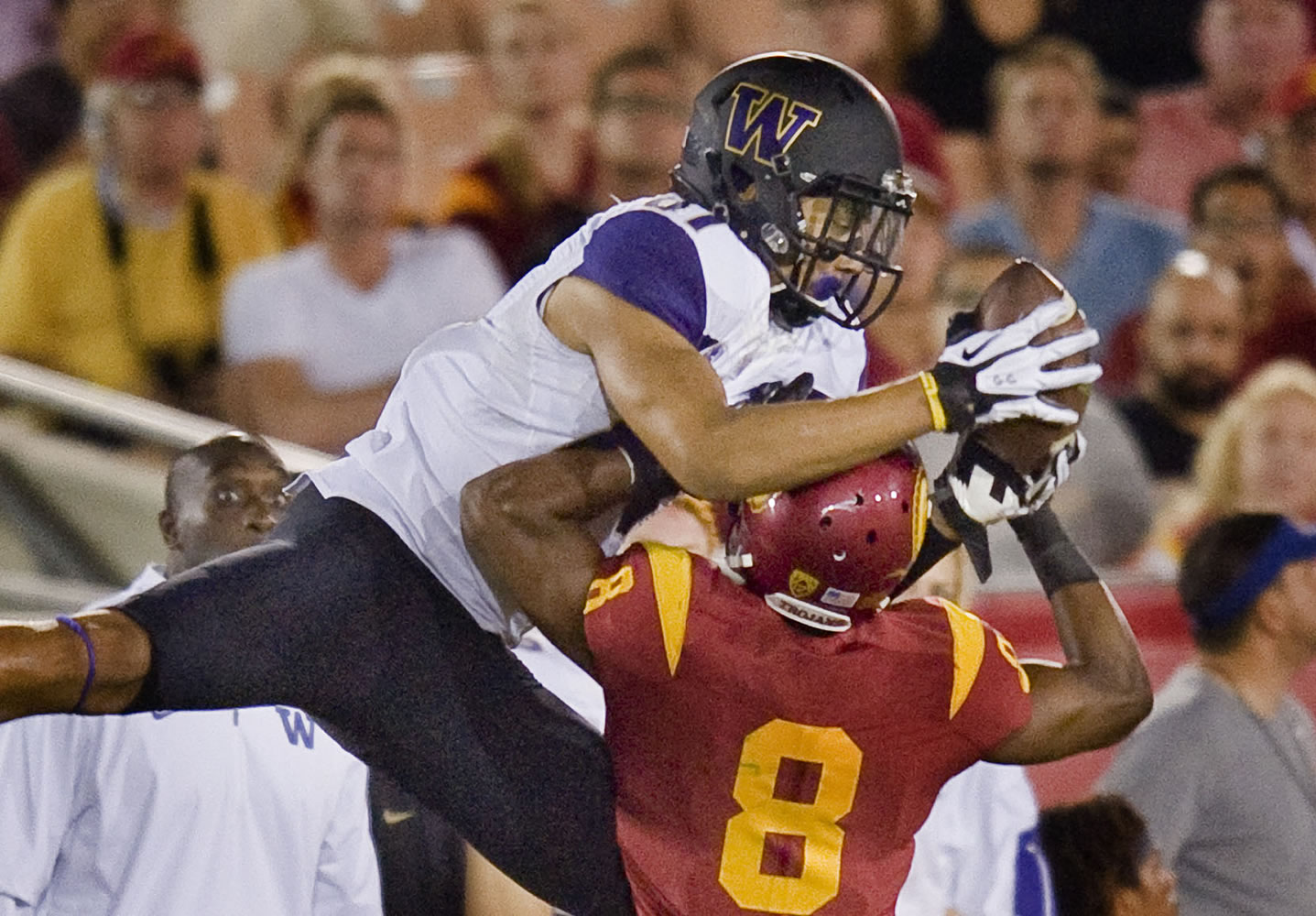 Washington wide receiver Brayden Lenius reaches over Southern California cornerback Iman Marshall to catch a pass during the third quarter of an NCAA college football game Thursday, Oct. 8, 2015, in Los Angeles. Washington won 17-12.