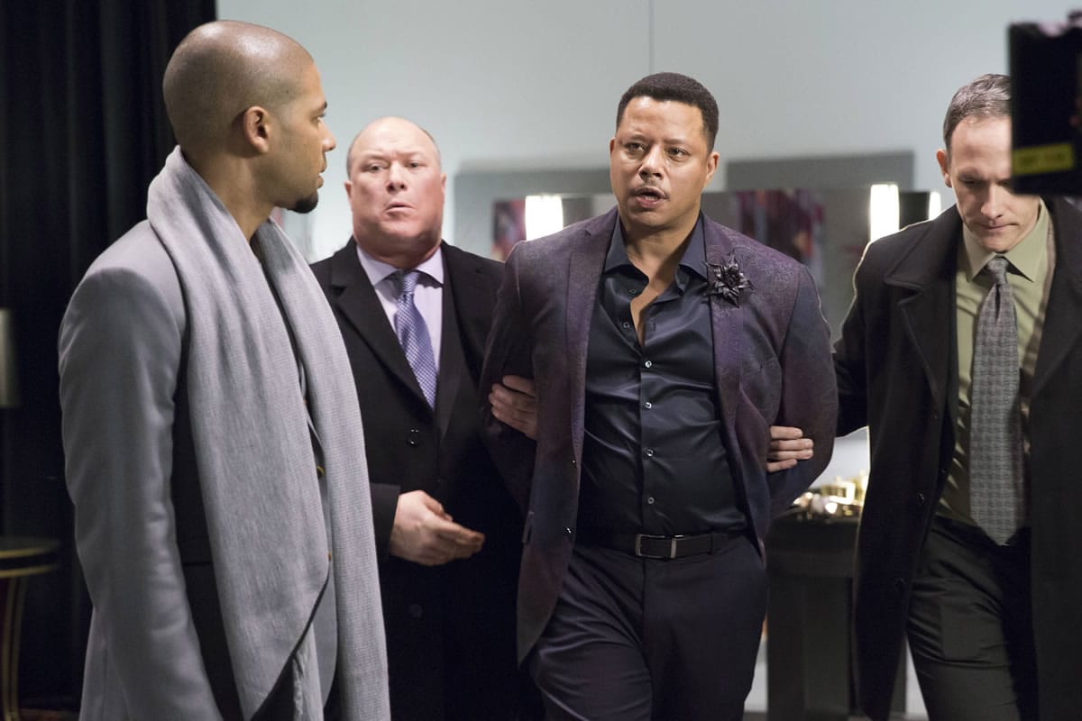 Jamal (Jussie Smollett, left) watches Lucious (Terrence Howard, right) get taken away in the season one finale of &quot;Empire.&quot; The Fox hit is seeing season-to-date live viewership gains.