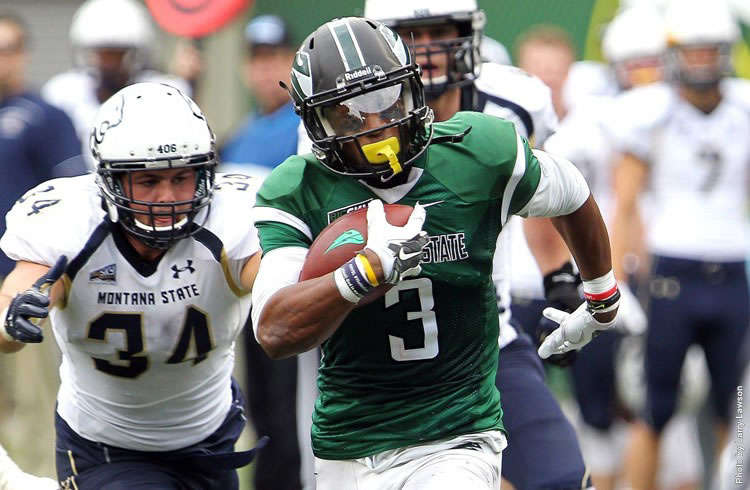 Portland State running back David Jones breaks through the Montana State defense for some of his 285 yards rushing on Saturday. Jones scored two touchdowns in the Vikings&#039; 59-42 win.
