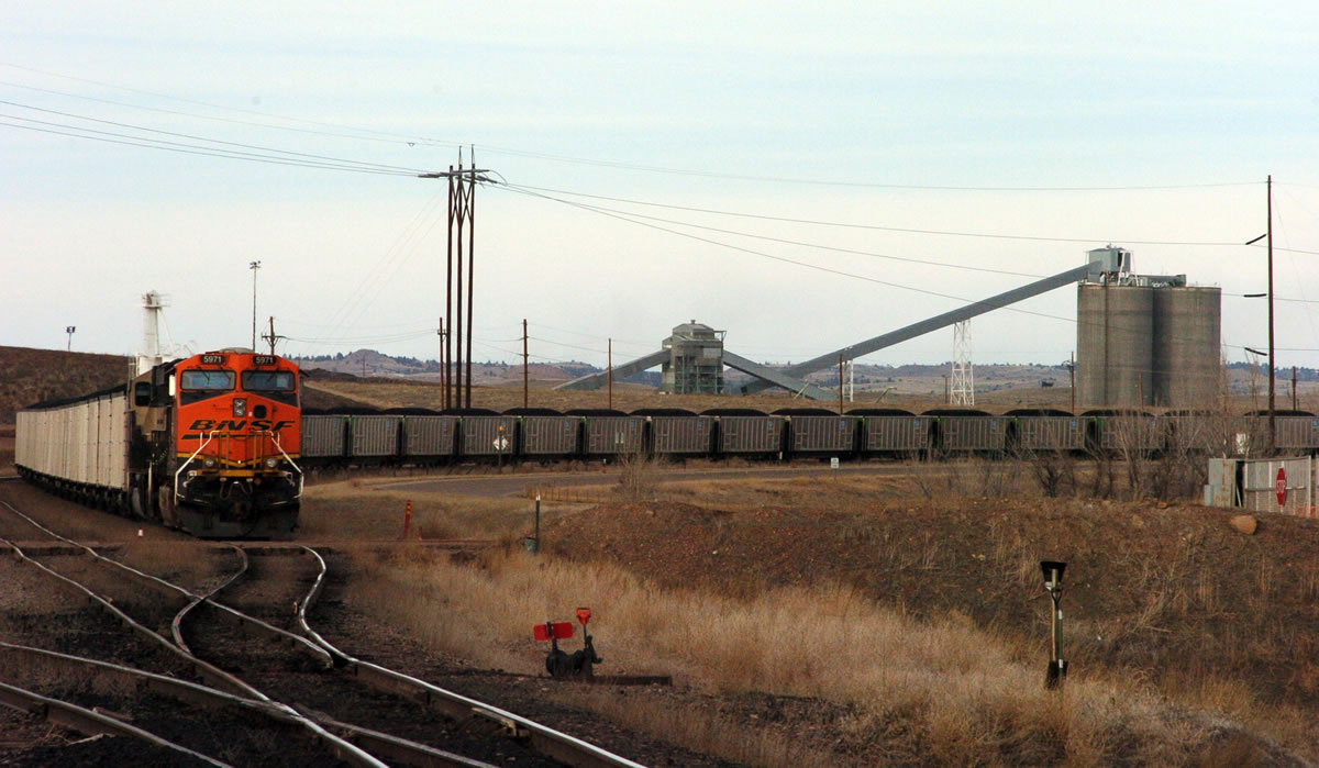 A coal train idles in front of the Decker Coal Mine near the Wyoming border in Decker, Mont., in January 2013.