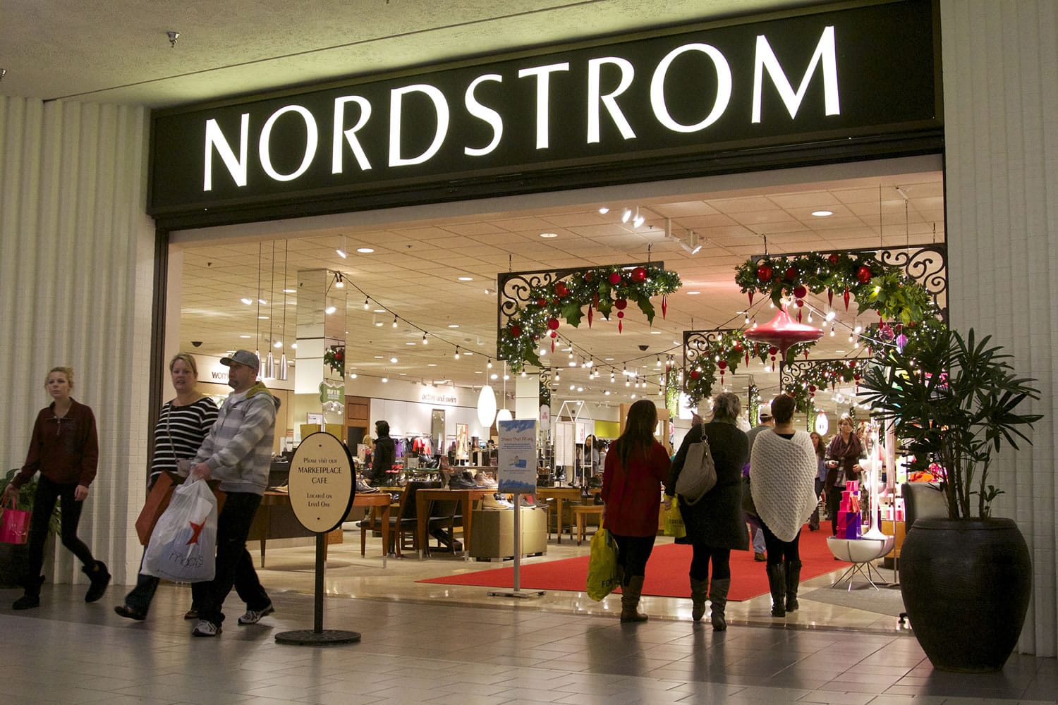 Shoppers leave Nordstrom at the Westfield Vancouver mall on Black Friday.