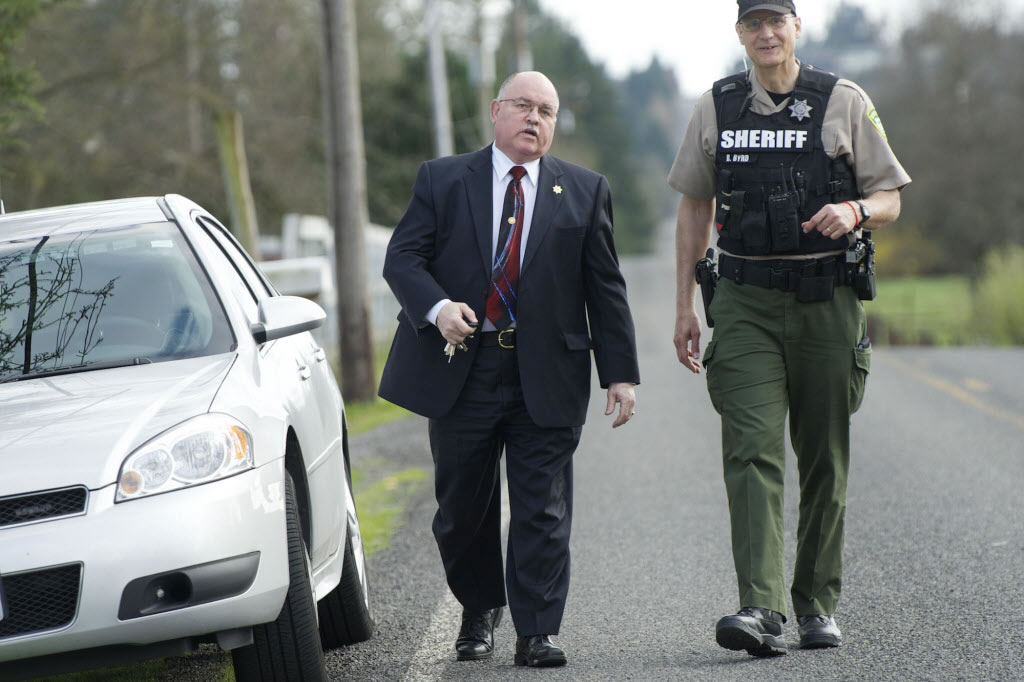 Clark County Sheriff Garry Lucas, left, with reserve deputy Robert Byrd, responded to a Ridgefield-area home after Derral Kenneth Mosby, a wanted man, was shot during a standoff in March.
