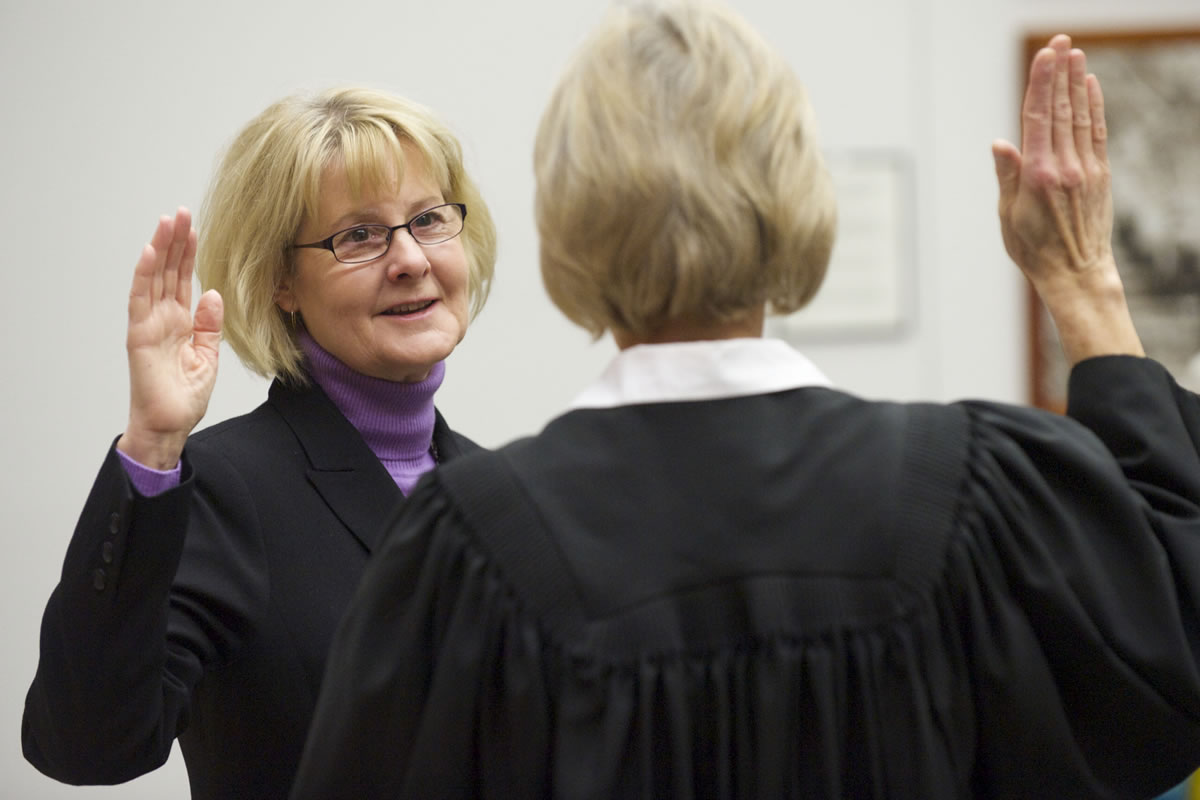 Clark County Councilor Jeanne Stewart is sworn in by Superior Court Judge Barbara Johnson during a ceremony at the Clark County Public Service Center on Monday.