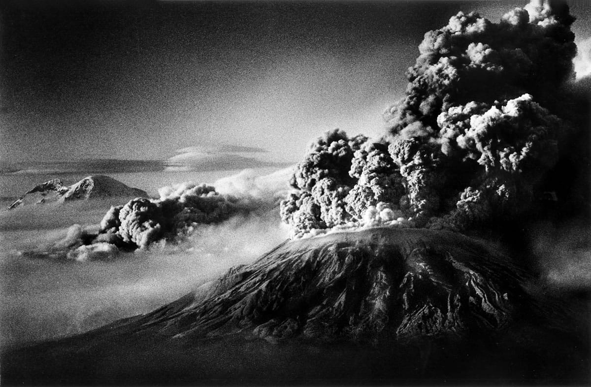 Mount St. Helens May 18, 1980, 5 to 6 p.m. Mount Rainier is at left. There was much speculation as to what looked like the secondary “eruption” to the left of Mount St. Helens.