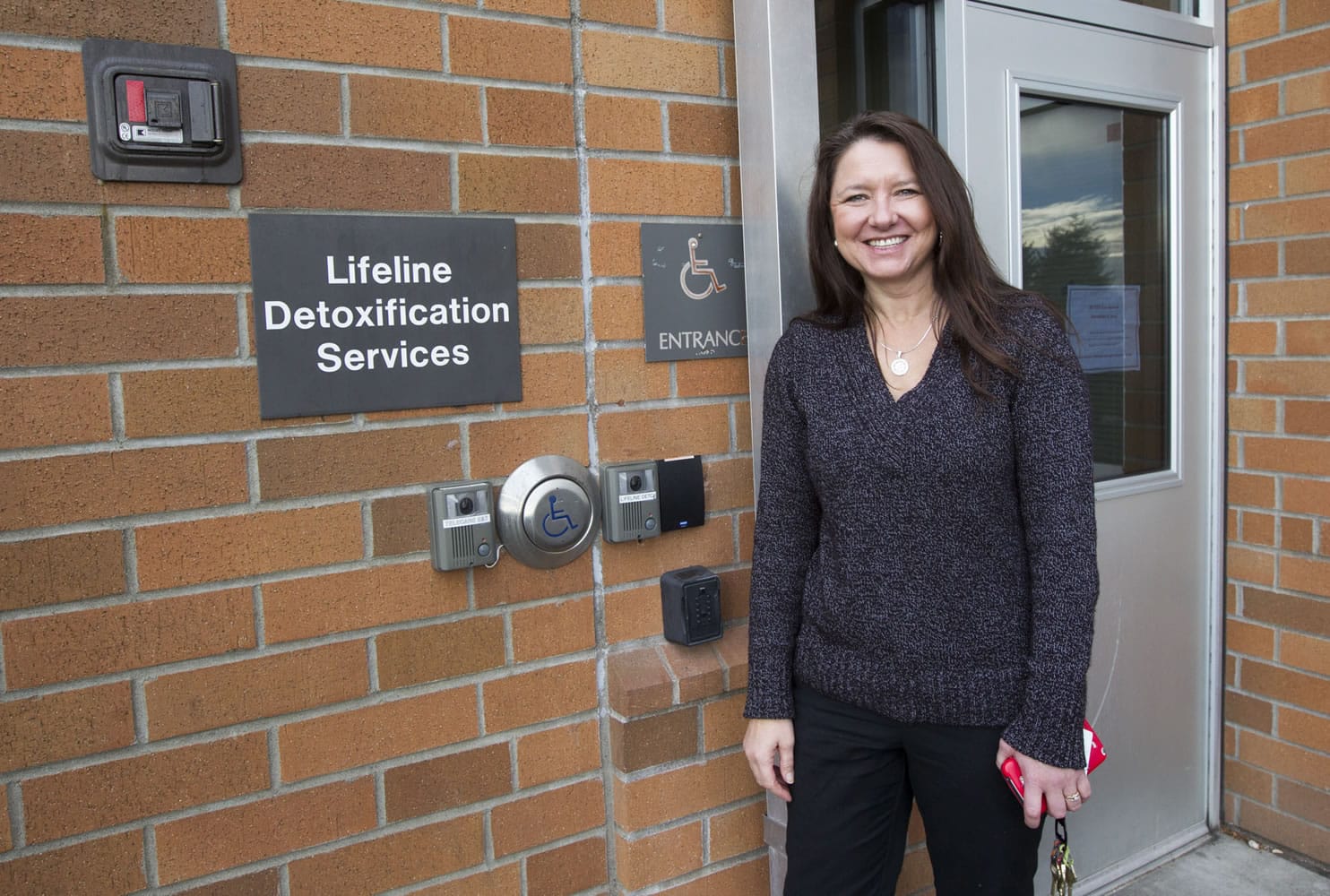 Shalyn Crimmel, a registered nurse who is director of detox services at Lifeline Connections, shows the secure back-door entrance to the new sobering unit.