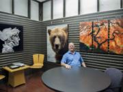 Randy Hopfer, owner of HD Aluminum Prints, is pictured with aluminum prints at his shop Thursday.