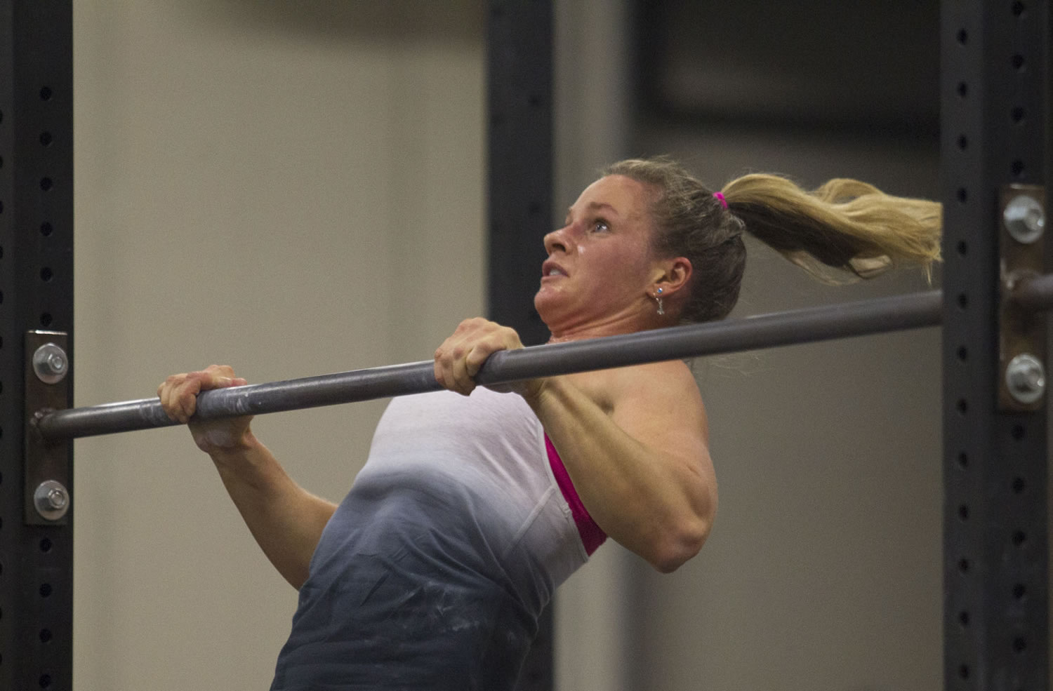 Karen MCcadam does a pull-up as she competes Saturday in the CrossFit Fort Vancouver Invitational at the Clark County Event Center at the Fairgrounds in Ridgefield.