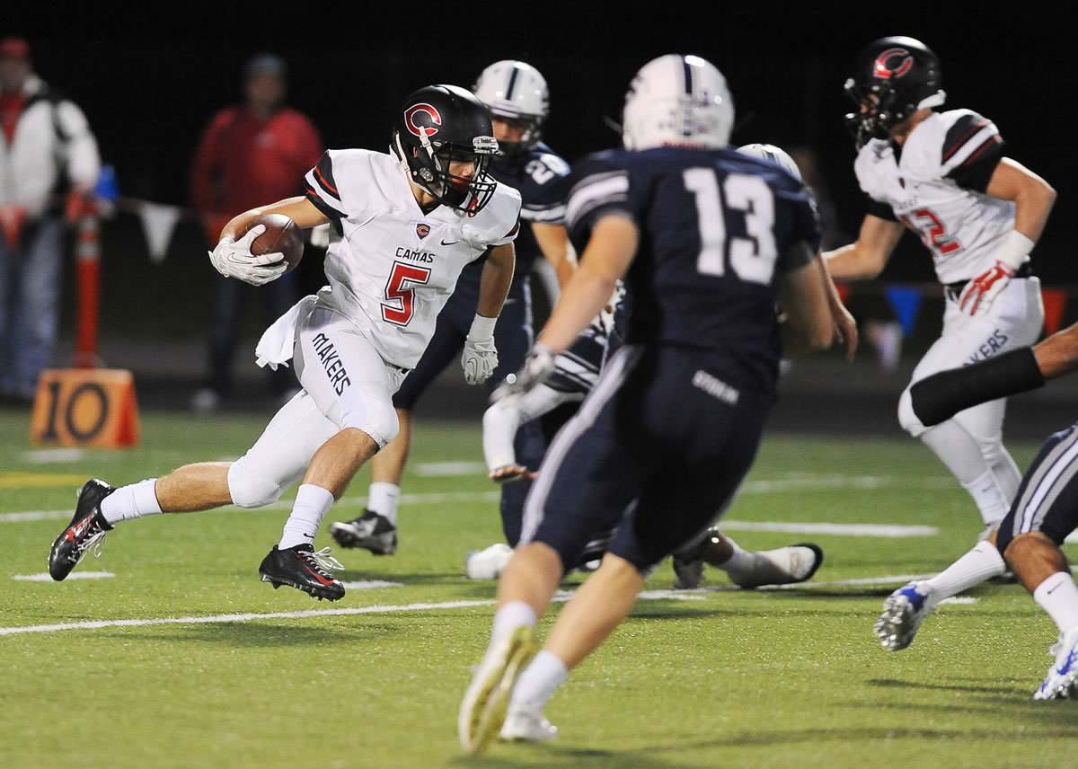 Camas player Jared Bentley runs with the ball at a football game versus Skyview High School at Kiggins Bowl in Vancouver Friday October 2, 2015.