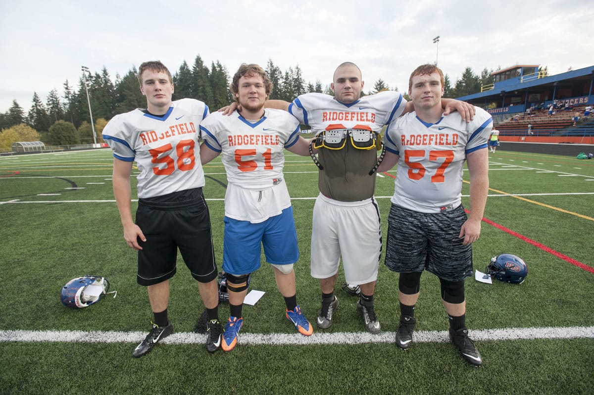Ridgefield senior linemen (from left to right) Lane Andersen, Jack McGinley, Jesse Dobson, and Logan Black are not the biggest, but they make up for that with their intensity.