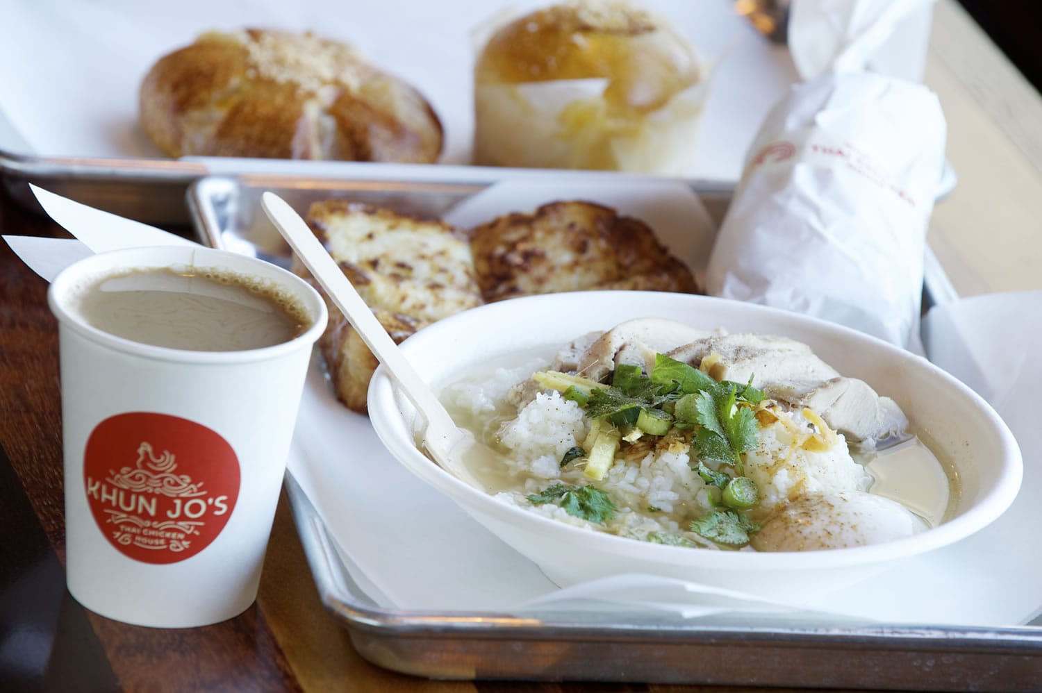 Milk toast, rice soup with chicken, a taro bun, background left, and a pineapple bun are served Dec.