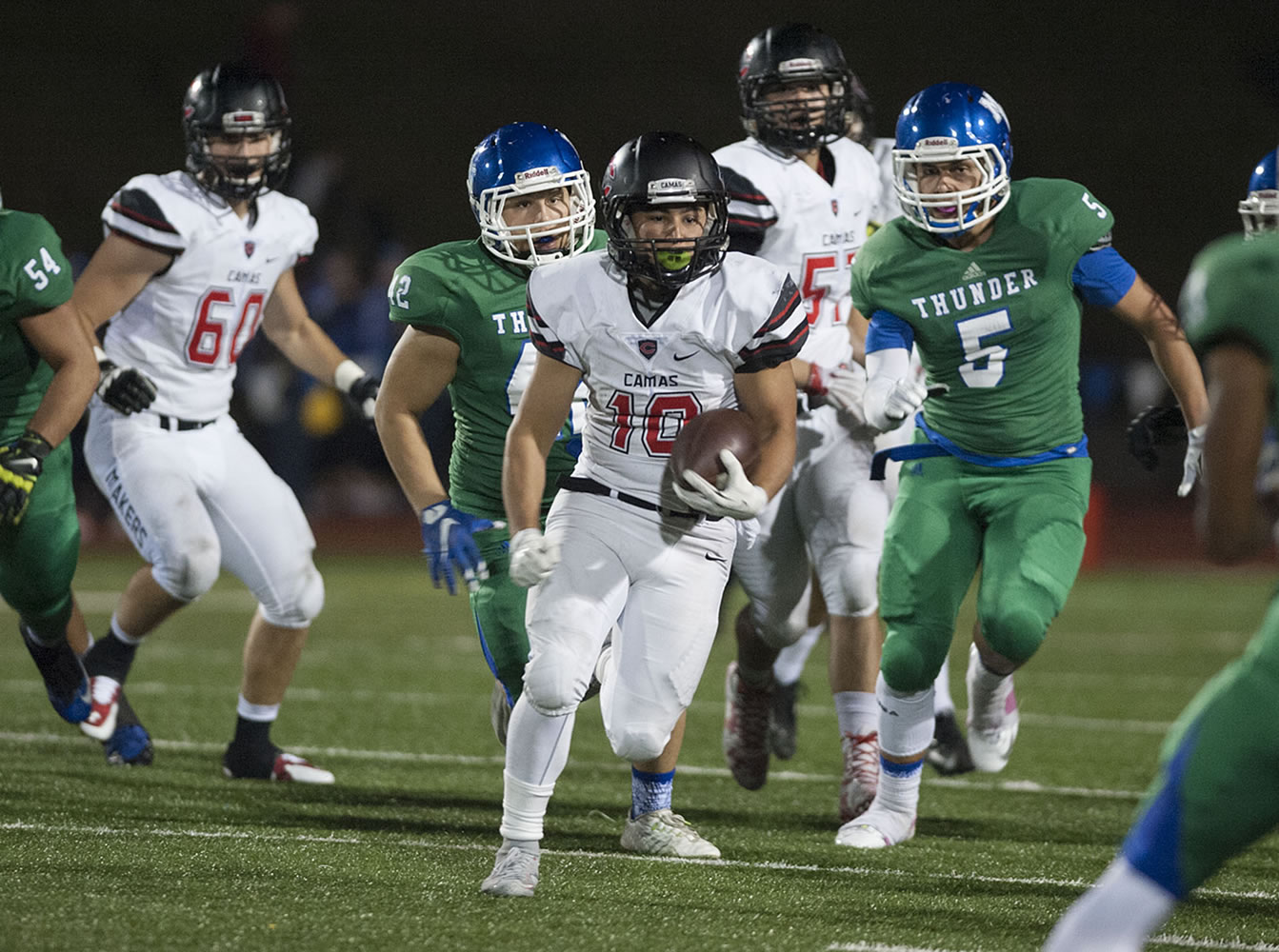 Camas' Jordan Del Moral (10) breaks free from a pack of players in the second quarter Friday night, Oct. 23, 2015 at McKenzie Stadium.