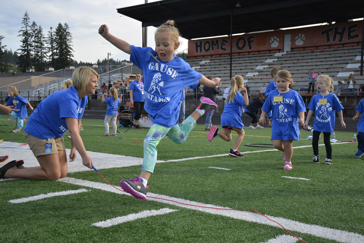 Washougal: Khloe Handley jumps over a rope at Gause Elementary School&#039;s 15th annual Sport-A-Thon on Sept.
