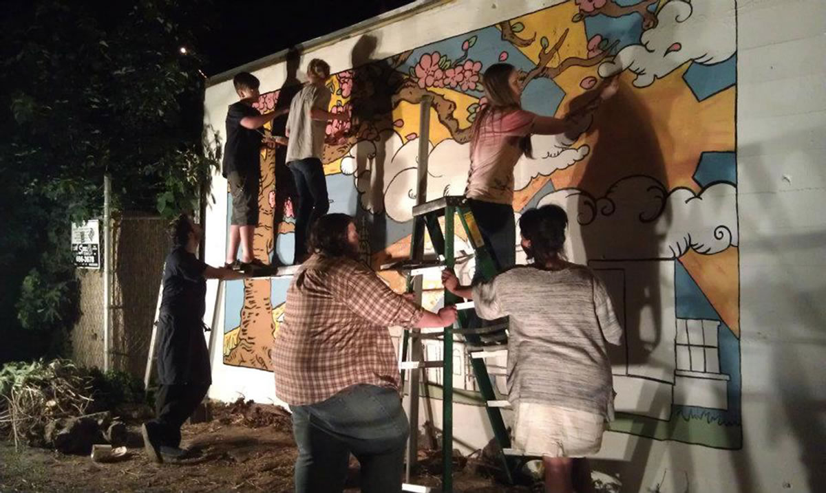 Mural construction under cover of night in 2012.