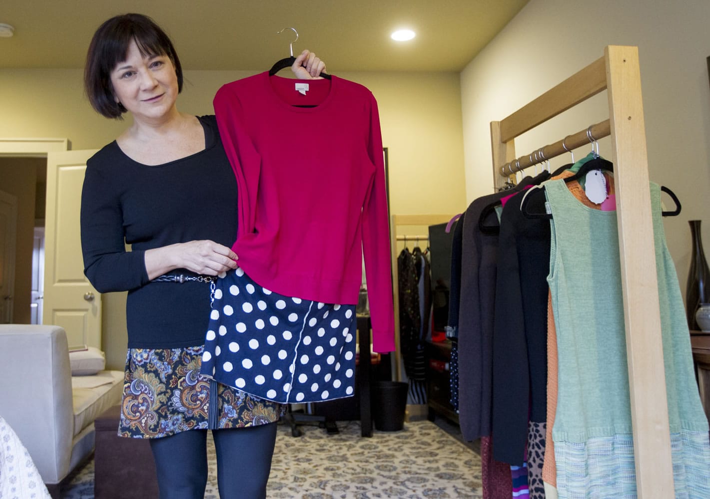 Leslie McMillan, who with her sister created a business called Sew Sisters, uses old clothing to create new apparel, such as this dress, at her home in Vancouver.