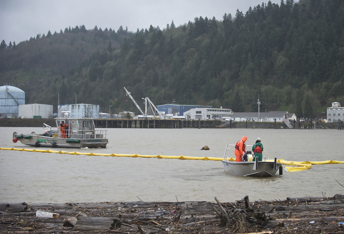 Crews deploy an absorbent boom on the Willamette River as part of an oil-spill training exercise in Portland last month. The Maritime Fire &amp; Safety Association's worst-case disaster scenario involves a spill of 300,000 barrels of oil into the water.