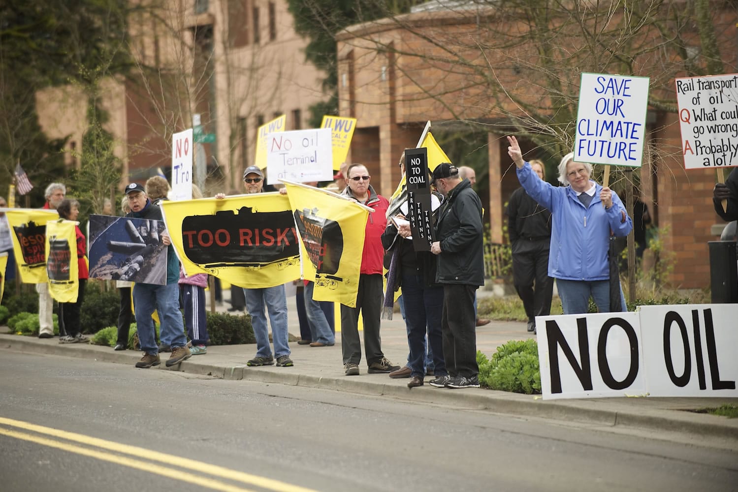 Protesters opposing an oil terminal at the Port of Vancouver gather Wednesday outside the Clark County Public Service Center before a meeting there of the state's Energy Facility Site Evaluation Council.