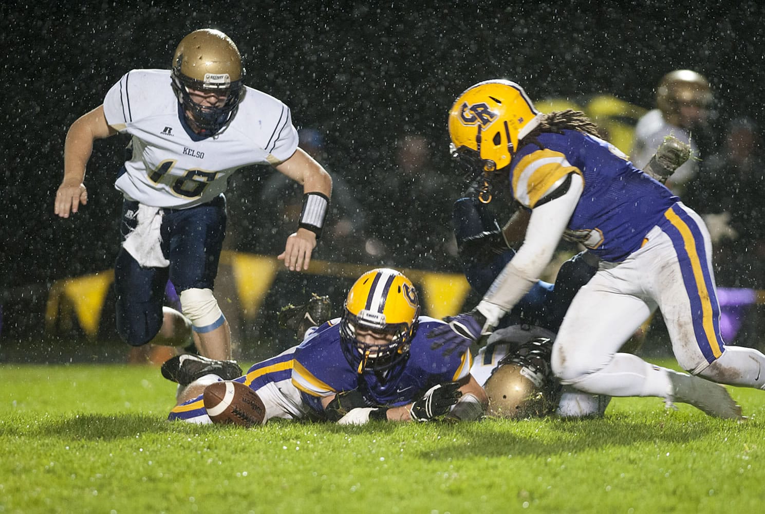 Columbia River&#039;s Hunter Pearson, right, closes in for a fumble recovery after Kelso lost the ball during the second quarter of Friday&#039;s Class 2A Greater St. Helens League game.