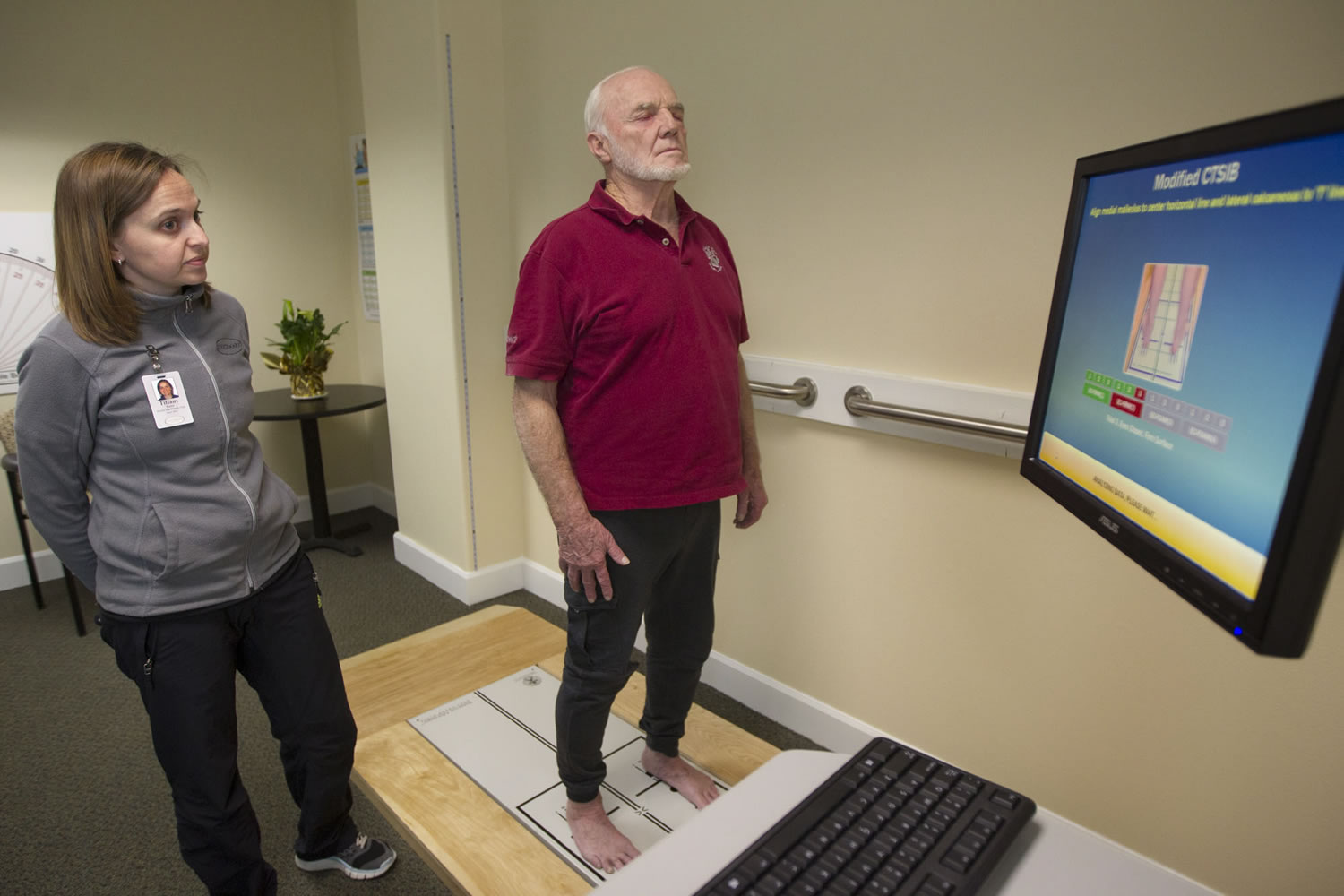 Vancouver resident John Marshall, 77, under the guidance of exercise specialist Tiffany Bunn, tests his balance on new Balance Master technology at Touchmark at Fairway Village in Vancouver.