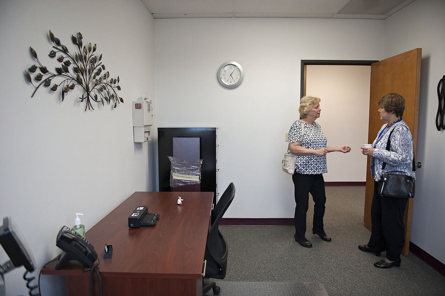 Connie Grenz, left, a Columbia River Mental Health Services board member, checks out the new therapy rooms with human resources director Ruth Nash.