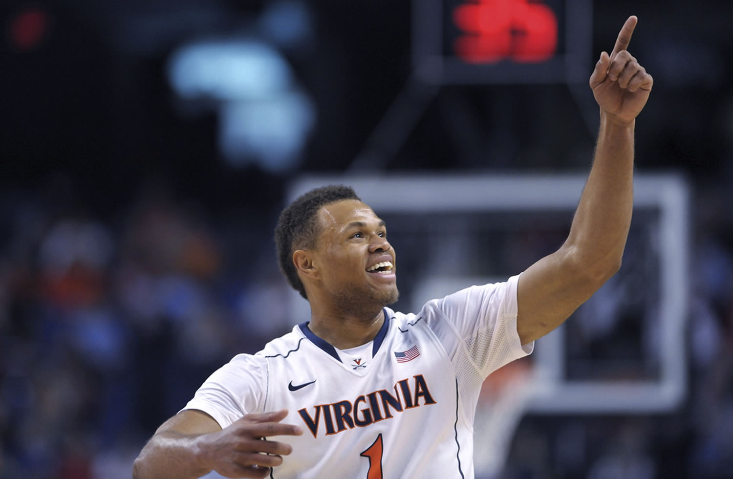 Virginia guard Justin Anderson points to the crowd in celebration. Virginia is among four No.
