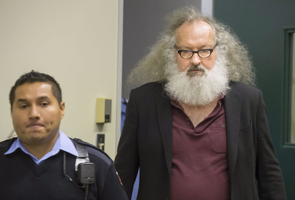 Actor Randy Quaid is escorted into his Immigration and Refugee Board hearing in Montreal on Thursday. Quaid said in an interview that he could be deported from Canada next week and that he would like to resolve his legal issues in California and &quot;move on with my life.&quot; The actor and his Canadian wife fled the U.S. in 2010, saying they were victims of persecution.