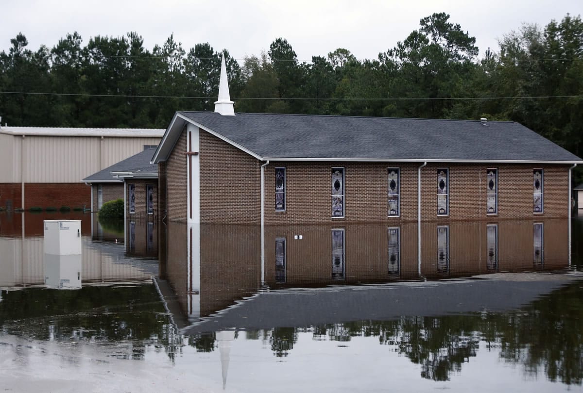 Floodwater surrounds the Canaan United Methodist Church in Ridgeville, S.C., Tuesday. Despite an improving forecast, it will still take weeks for the state to return to normal after being pummeled by an historic rainstorm.