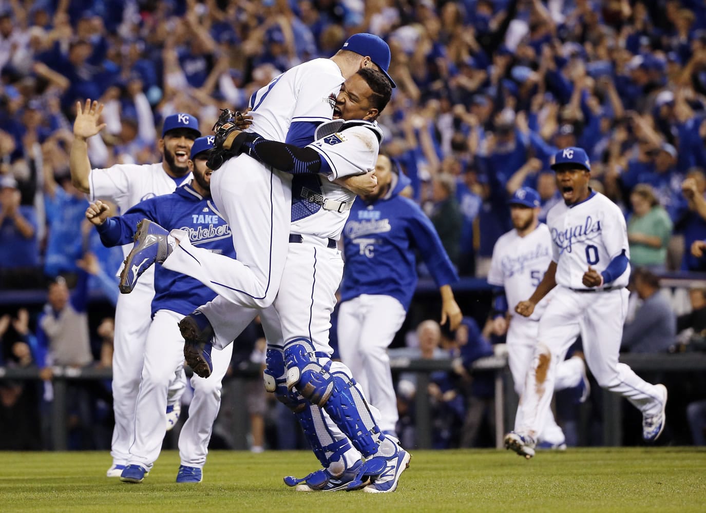 Kansas City Royals relief pitcher Wade Davis, left, and catcher Salvador Perez celebrates their 4-3 win against the Toronto Blue Jays in Game 6 of baseball's American League Championship Series on Friday, Oct. 23, 2015, in Kansas City, Mo.